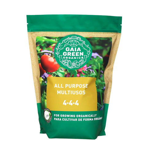 In-use scene applying Gaia Green nutrients to thriving tomato plants.