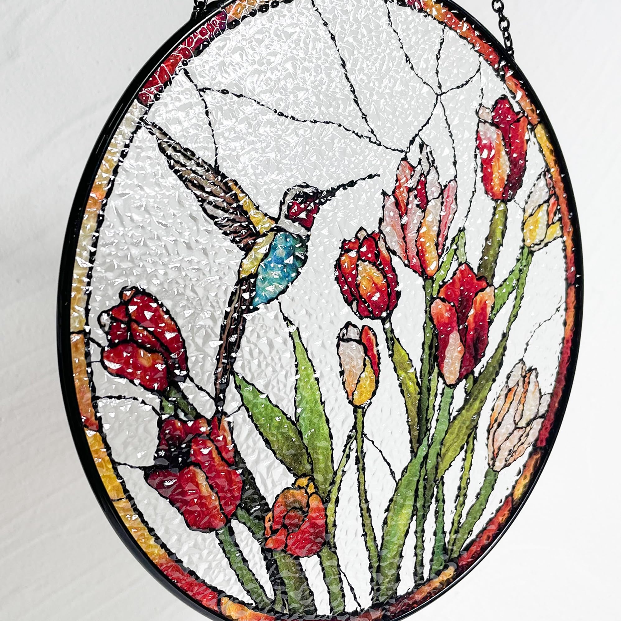 Galag hummingbird and tulips stained-glass suncatcher makes a thoughtful nature-inspired gift.