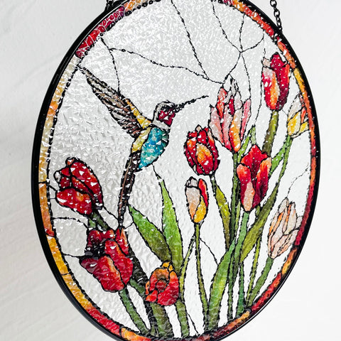 Galag hummingbird and tulips stained-glass suncatcher makes a thoughtful nature-inspired gift.