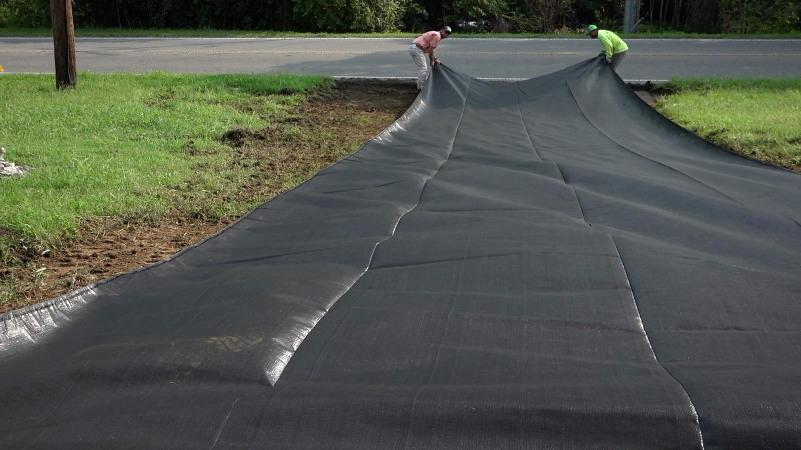 ArmorLay underlayment set beneath a driveway showing substrate support