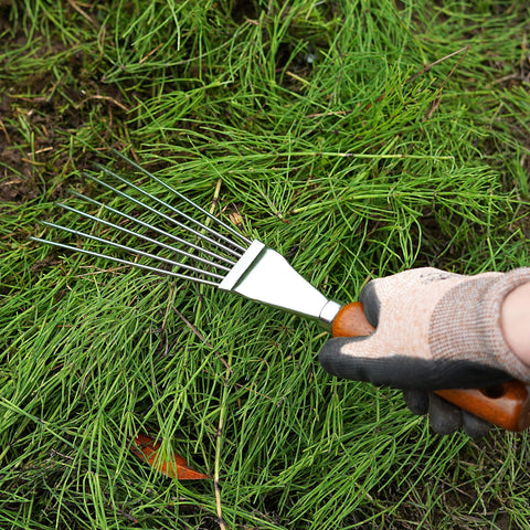 Garden Helper hand rake wooden handle grip for comfortable, steady use.