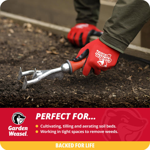Garden Weasel double-sided cultivator tines in action breaking up compacted soil.