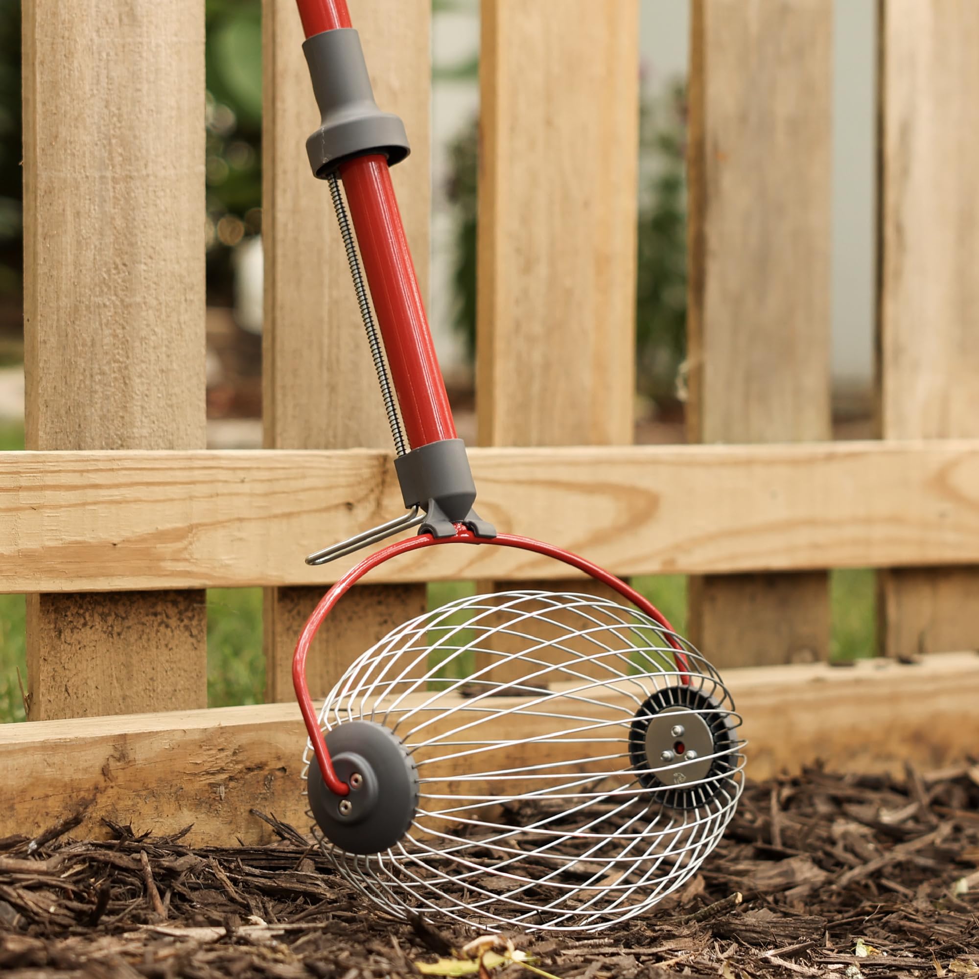 Garden Weasel rolling smoothly over uneven terrain and gravel.