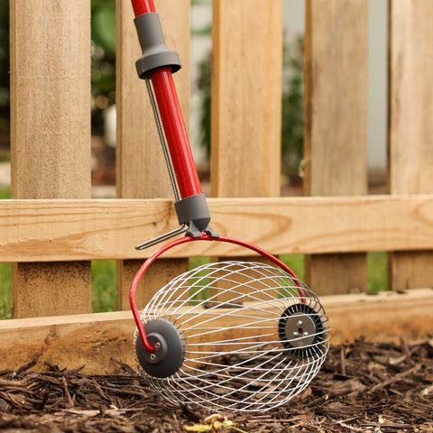 Garden Weasel rolling smoothly over uneven terrain and gravel.
