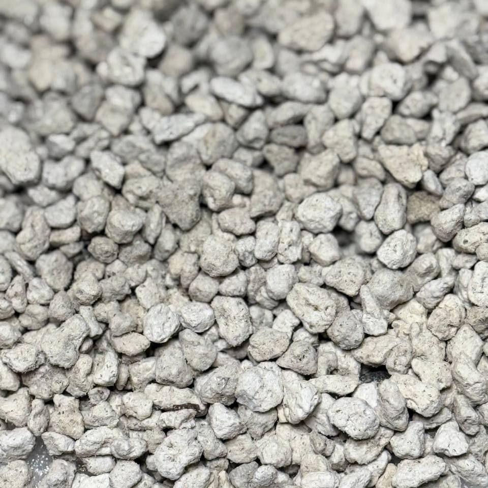 GardenWise pumice for drainage in plant pots, enhancing soil airflow.
