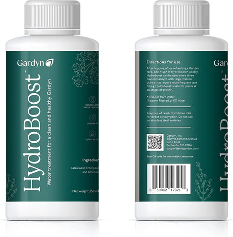 Gardyn HydroBoost bottle with plant growth in the background.