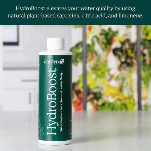 Gardyn HydroBoost action reducing pH level in hydroponic water.