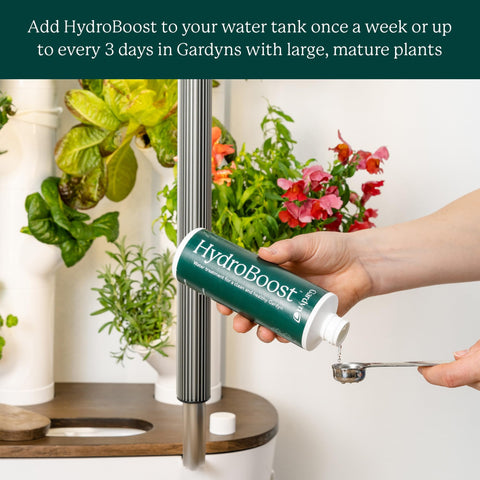 Gardyn HydroBoost in Gardyn tank during mixing for balanced water chemistry.