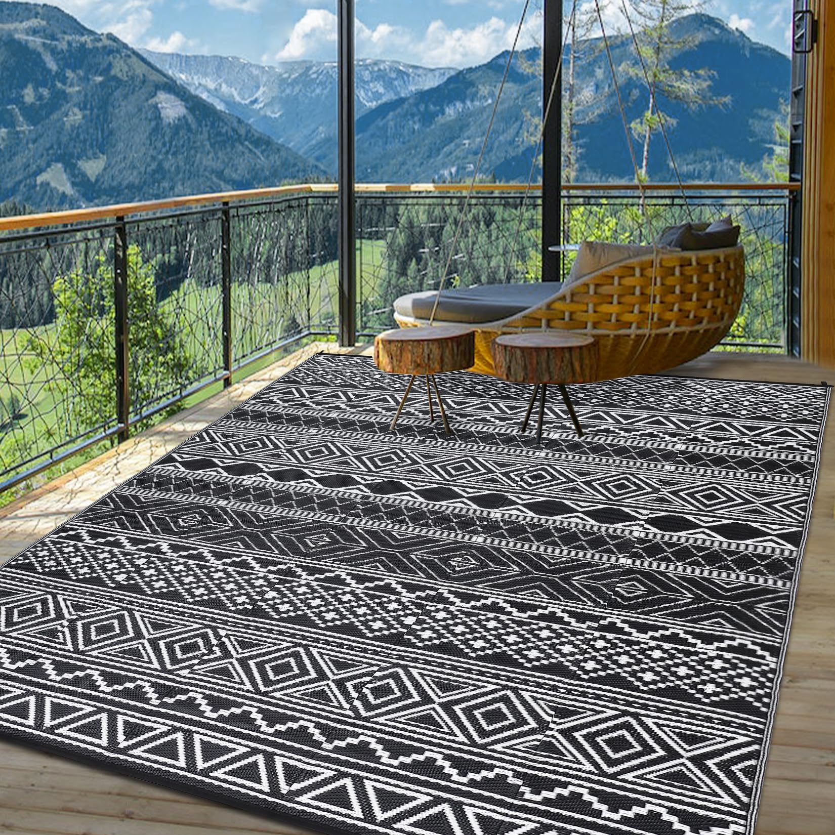 Garvee outdoor rug in camping RV scene emphasizing portable, foldable design with carry bag