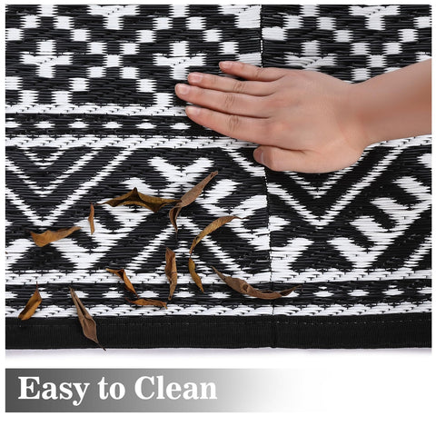 Garvee outdoor rug being rinsed for easy cleaning and quick drying