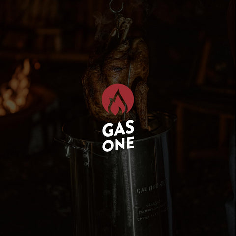 Gas One complete fryer kit items arranged for outdoor cooking
