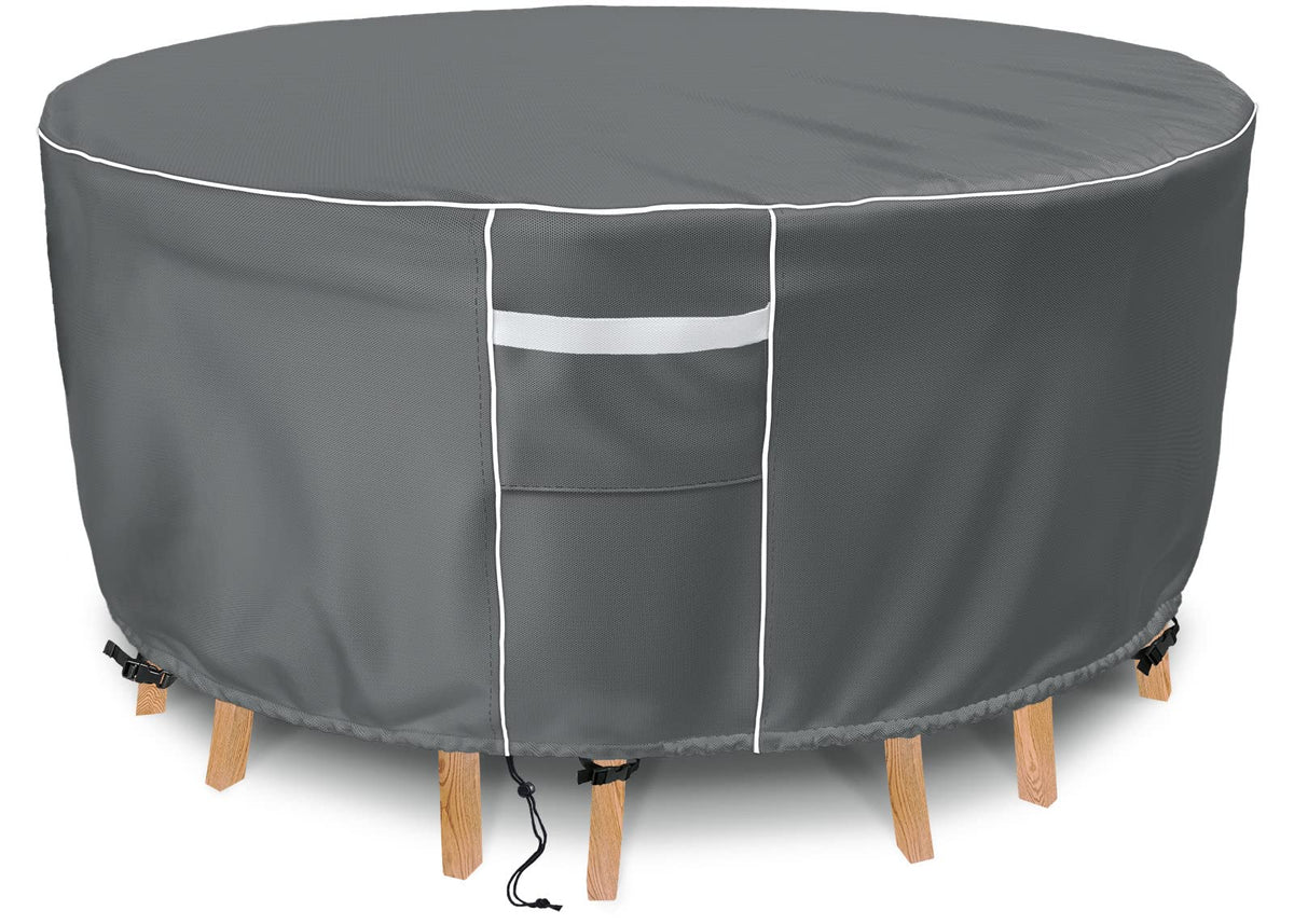 Gasadar round furniture cover protecting a 62-inch round table and chairs outdoors