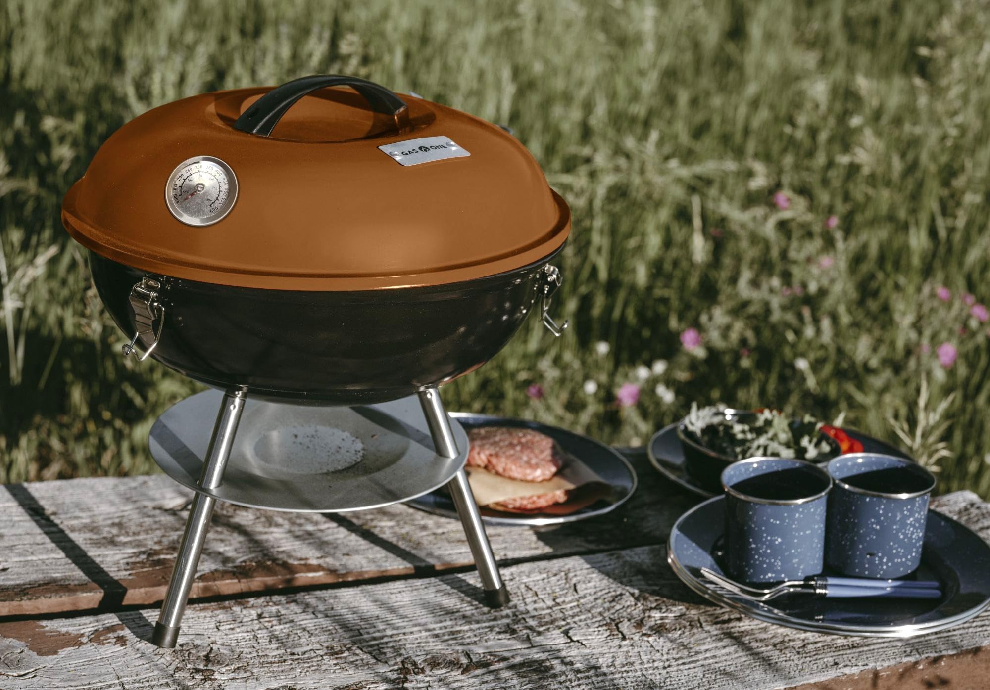 Gas One portable grill in outdoor setting ready for backyard or camping use