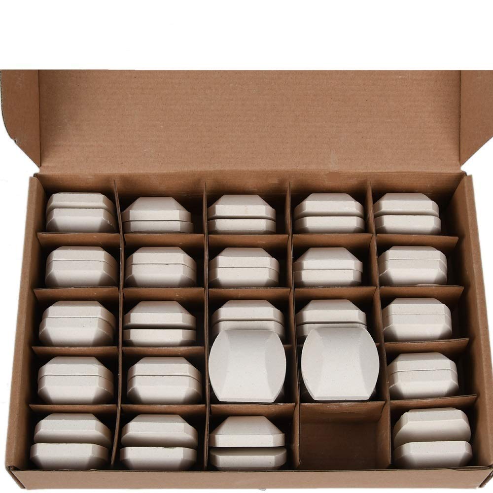 GasSaf ceramic briquettes laid out for even heat distribution in a grill.