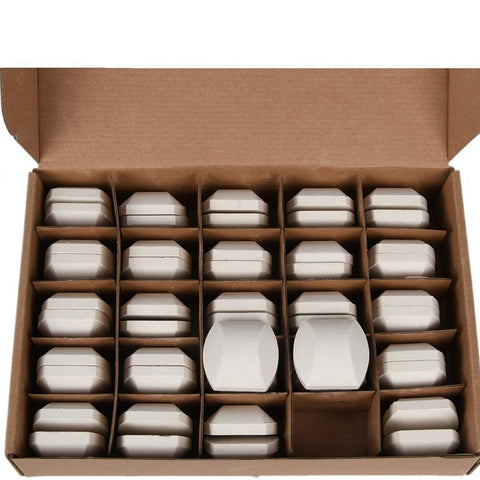 GasSaf ceramic briquettes laid out for even heat distribution in a grill.