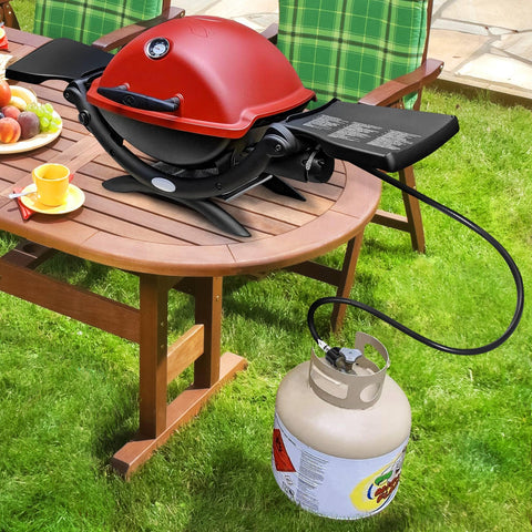 GasSaf hose connected to a Weber Q-compatible grill for outdoor meals.