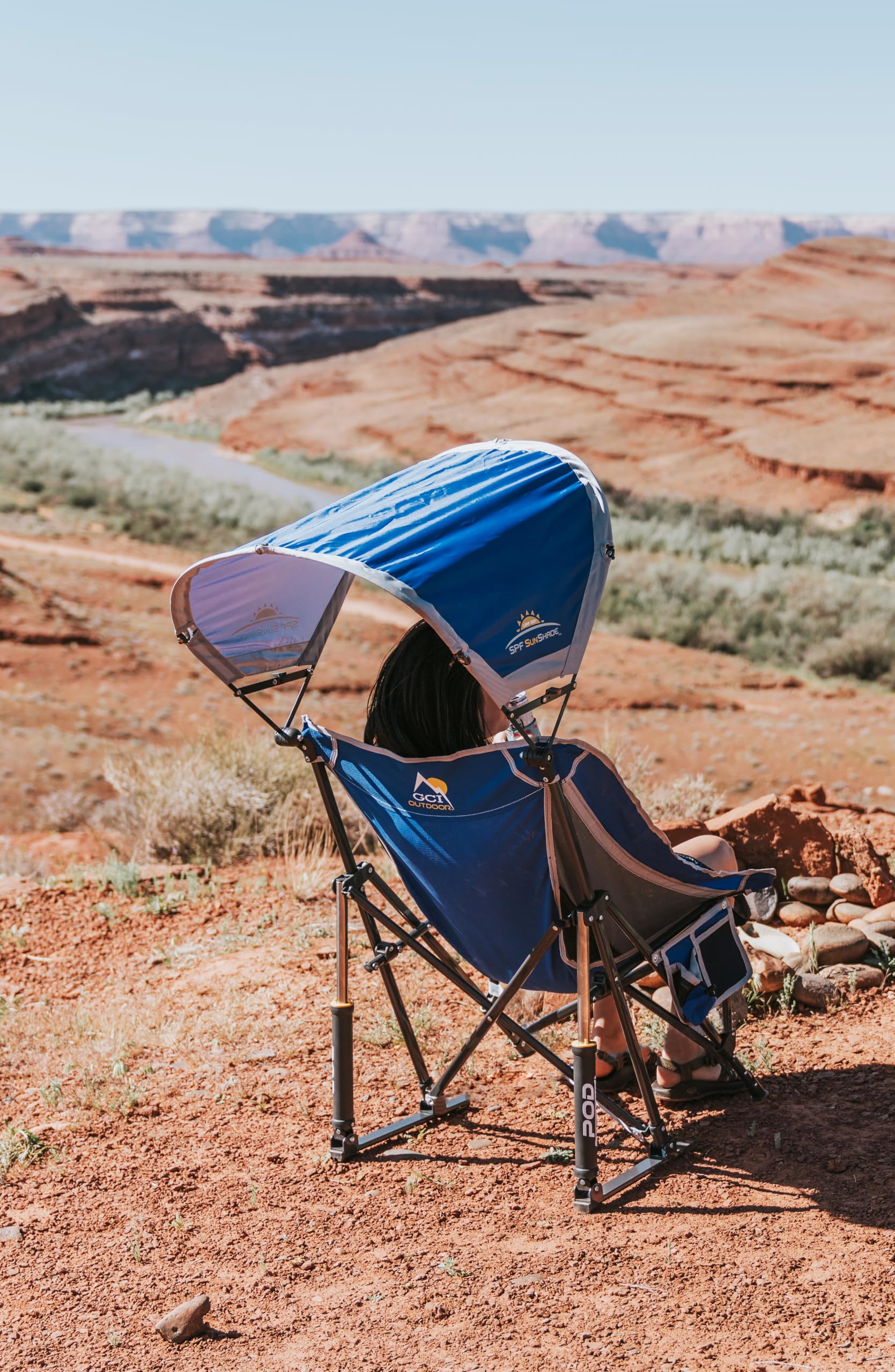 GCI Outdoor Pod Rocker with SunShade canopy shading sunny days.