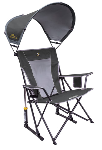 GCI Outdoor Sunshade Rocker open in sunlight at a campsite, featuring smooth rocking action
