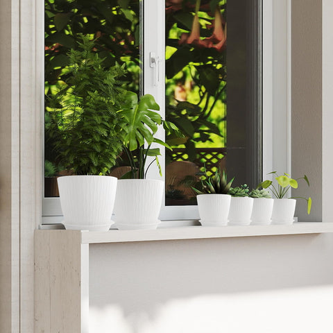 GDJUQZ matte-finish planters add a modern touch to any room.