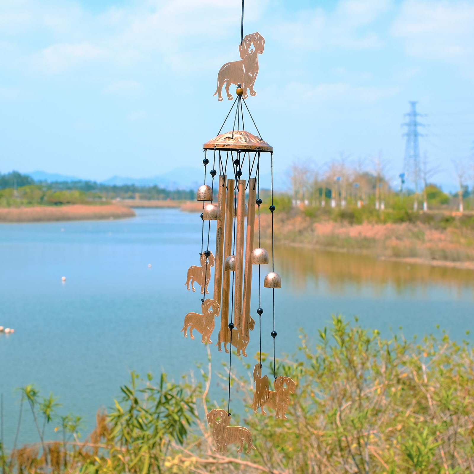 GDNSFIT dachshund wind chime in garden decor setting with multiple figures.