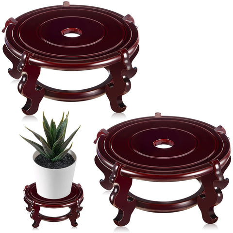 Geetery wooden plant stand with rosewood base elevates vases for elegant indoor display.