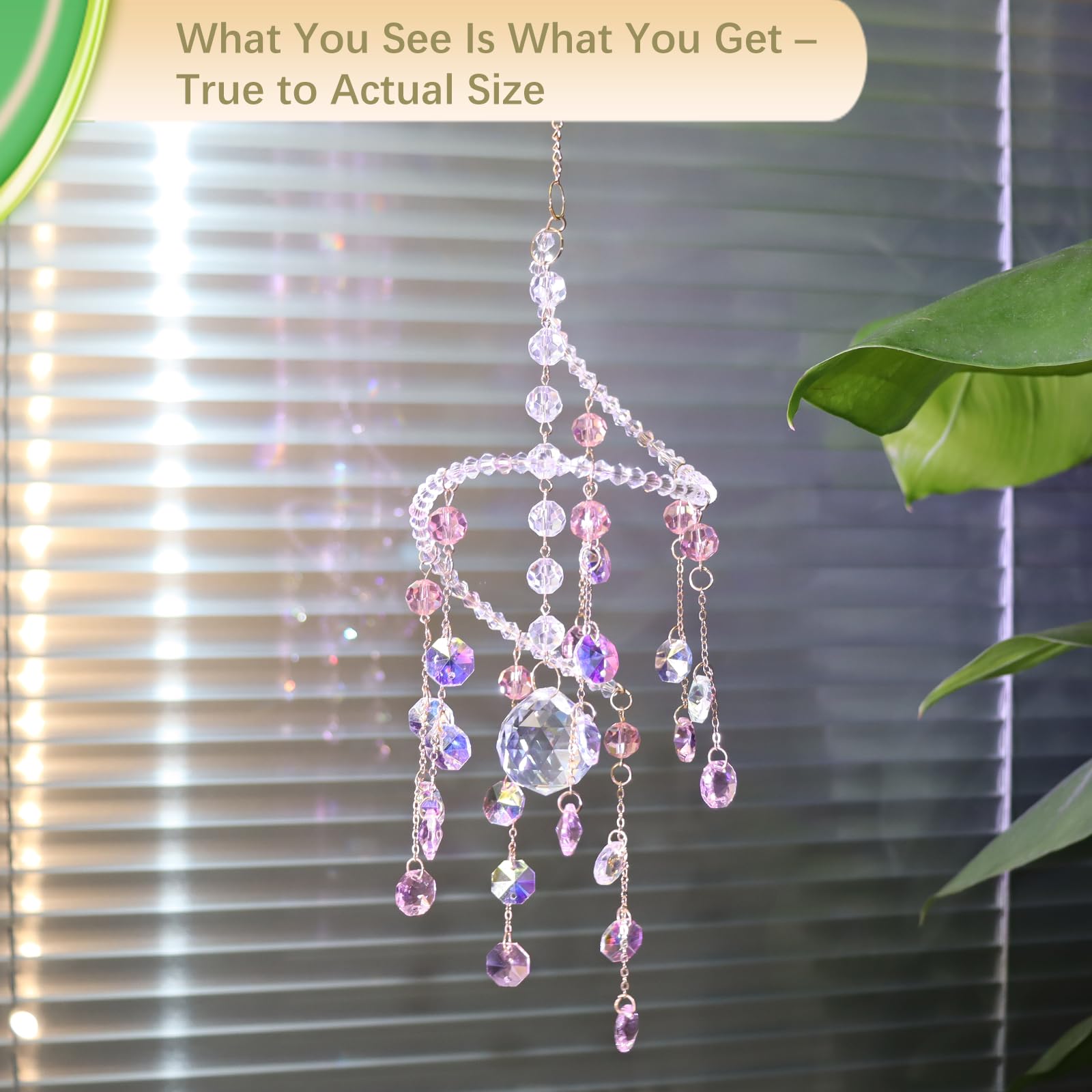 Geili pink spiral window ornament sparkles in soft overcast light