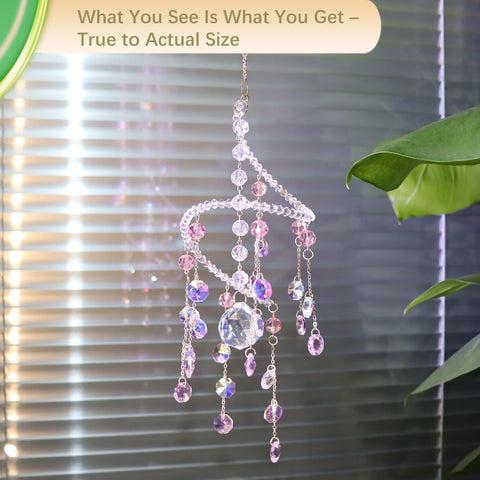 Geili pink spiral window ornament sparkles in soft overcast light