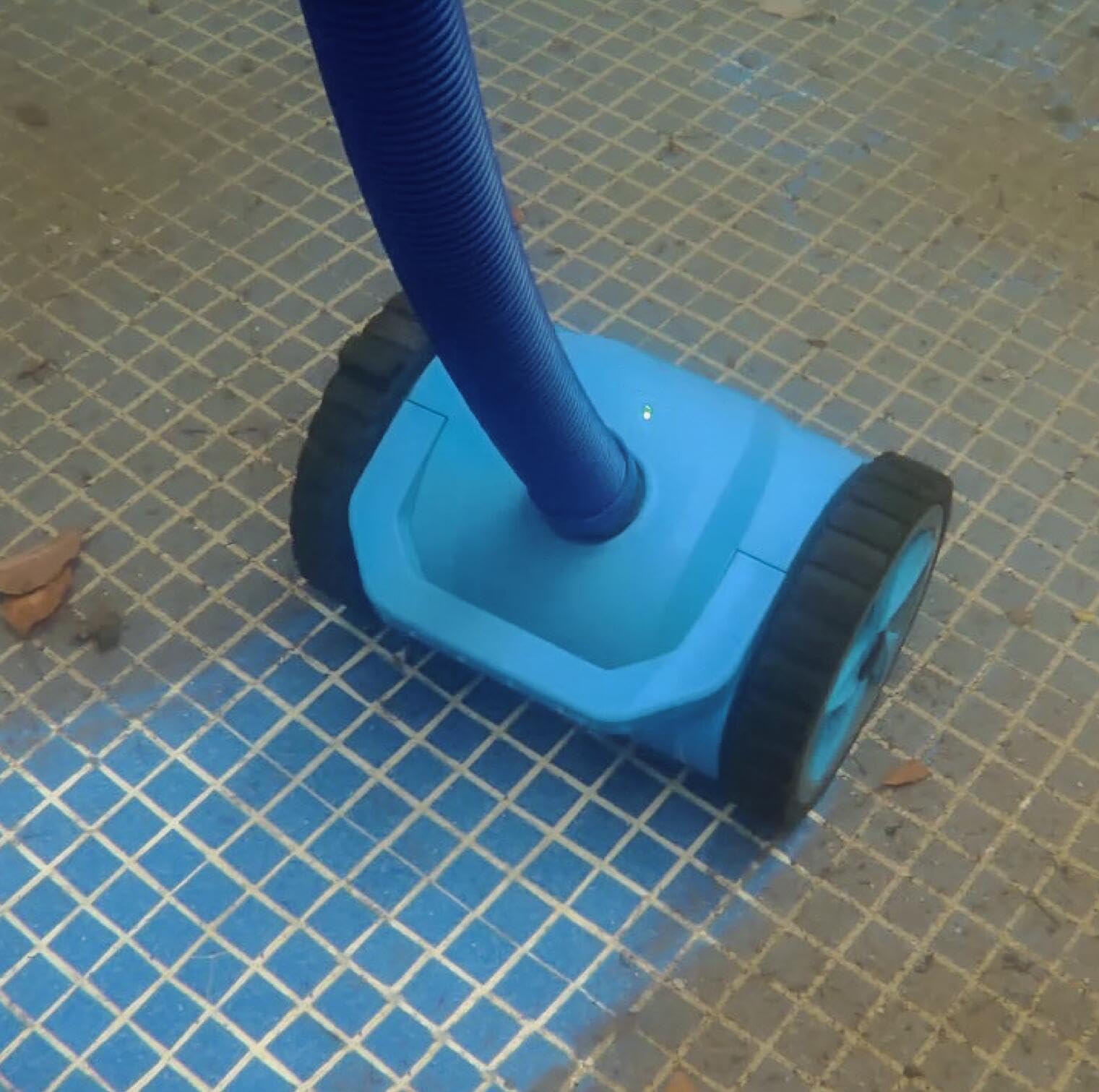 Generic blue pool cleaner in action delivering quiet cleaning
