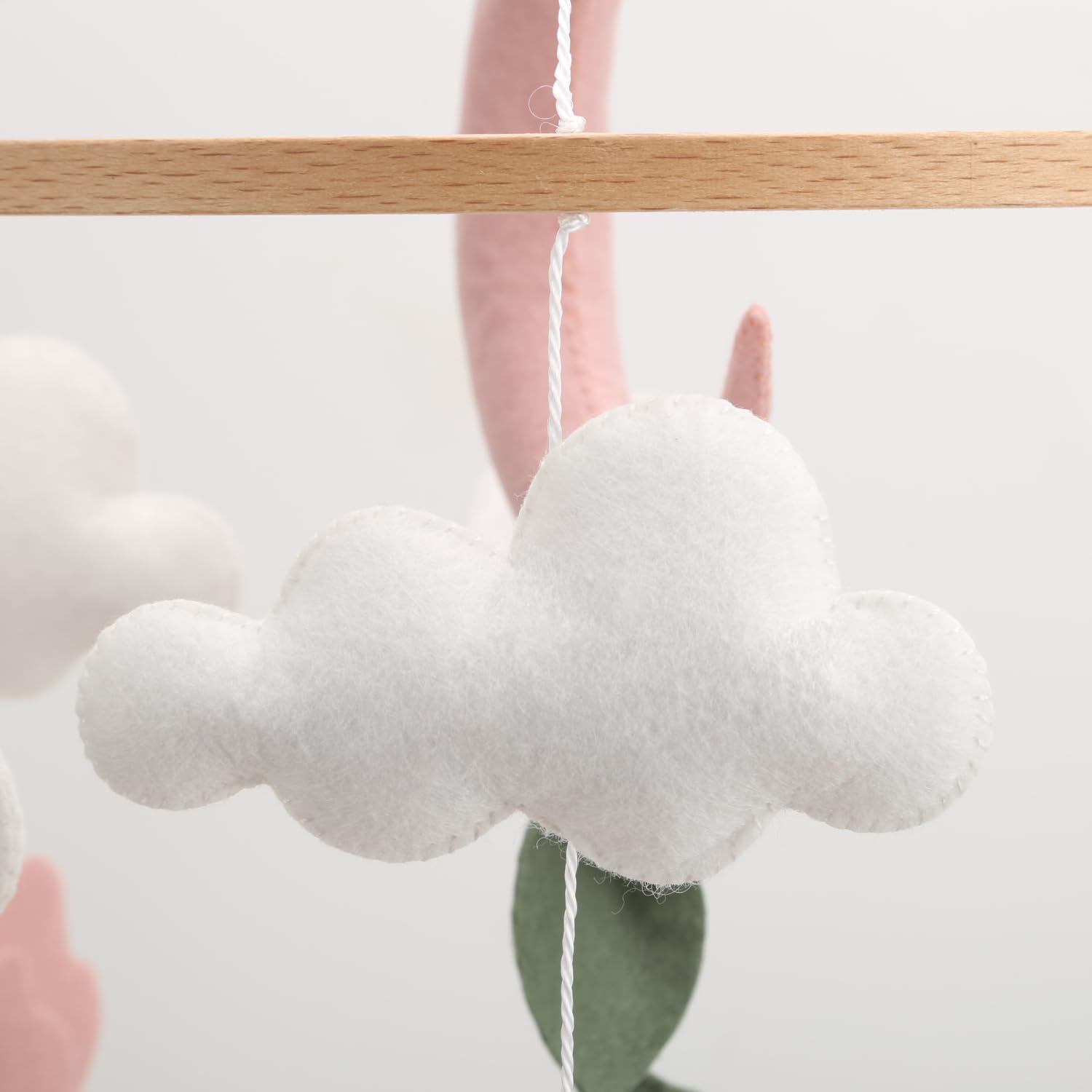 Generic Deer Hanging Mobile highlights floral accents for gentle, imaginative play.