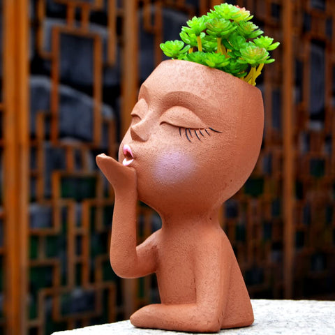 Generic Face Planter outdoor display demonstrates durable resin for exterior use.