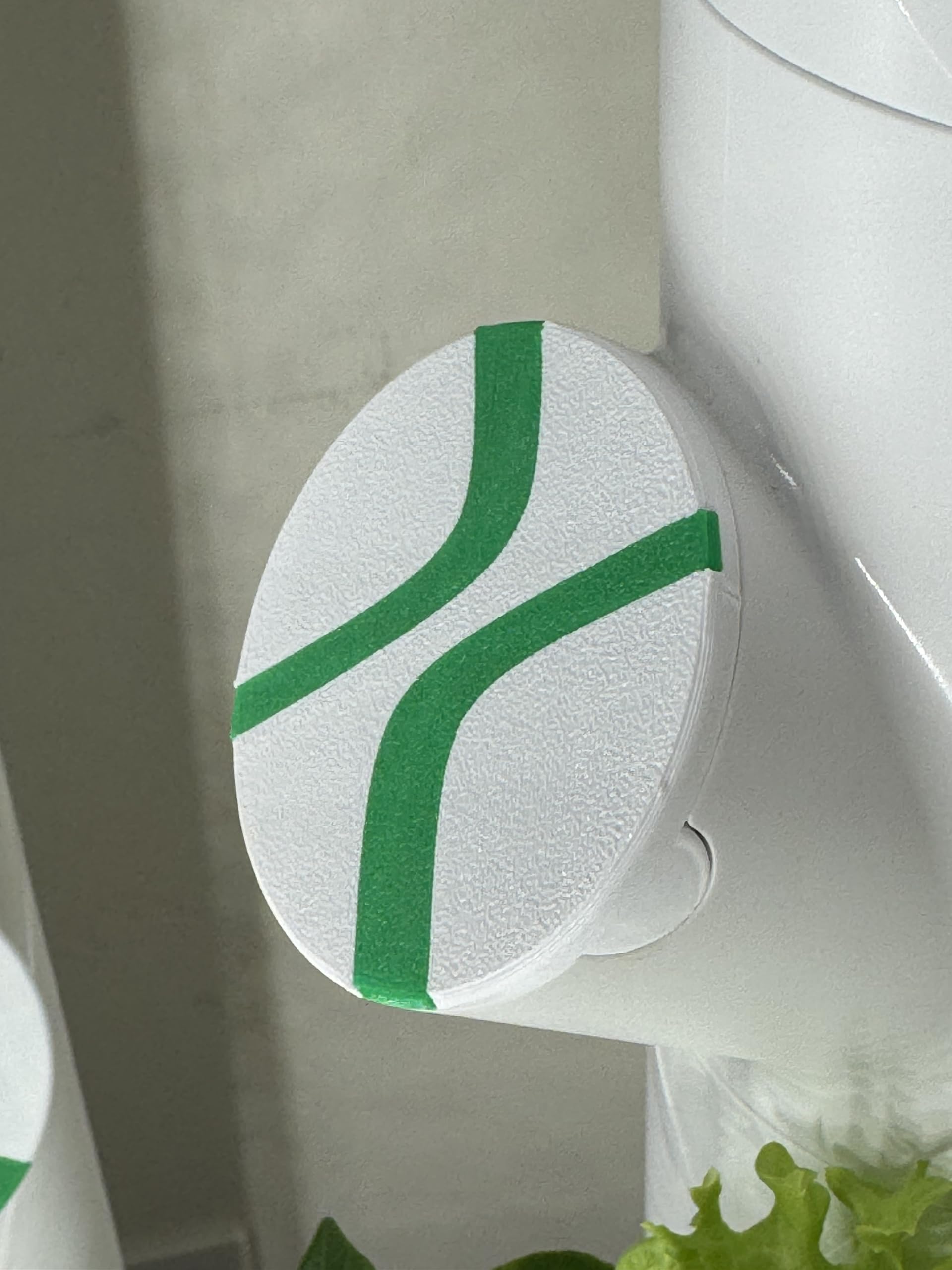 Generic MyGardyn Cap with black lining blocks stray light for healthier, more uniform indoor greens.