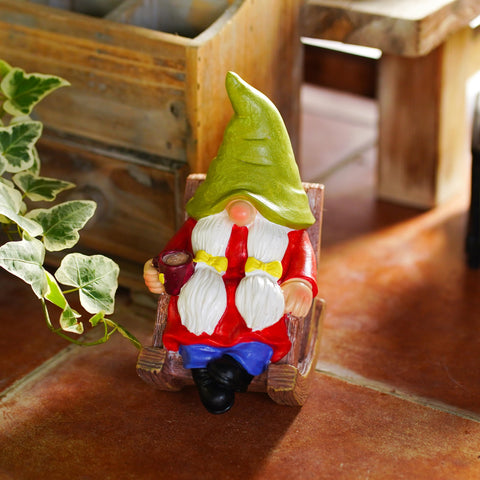 Whimsical coffee gnome brightens any garden or balcony display.
