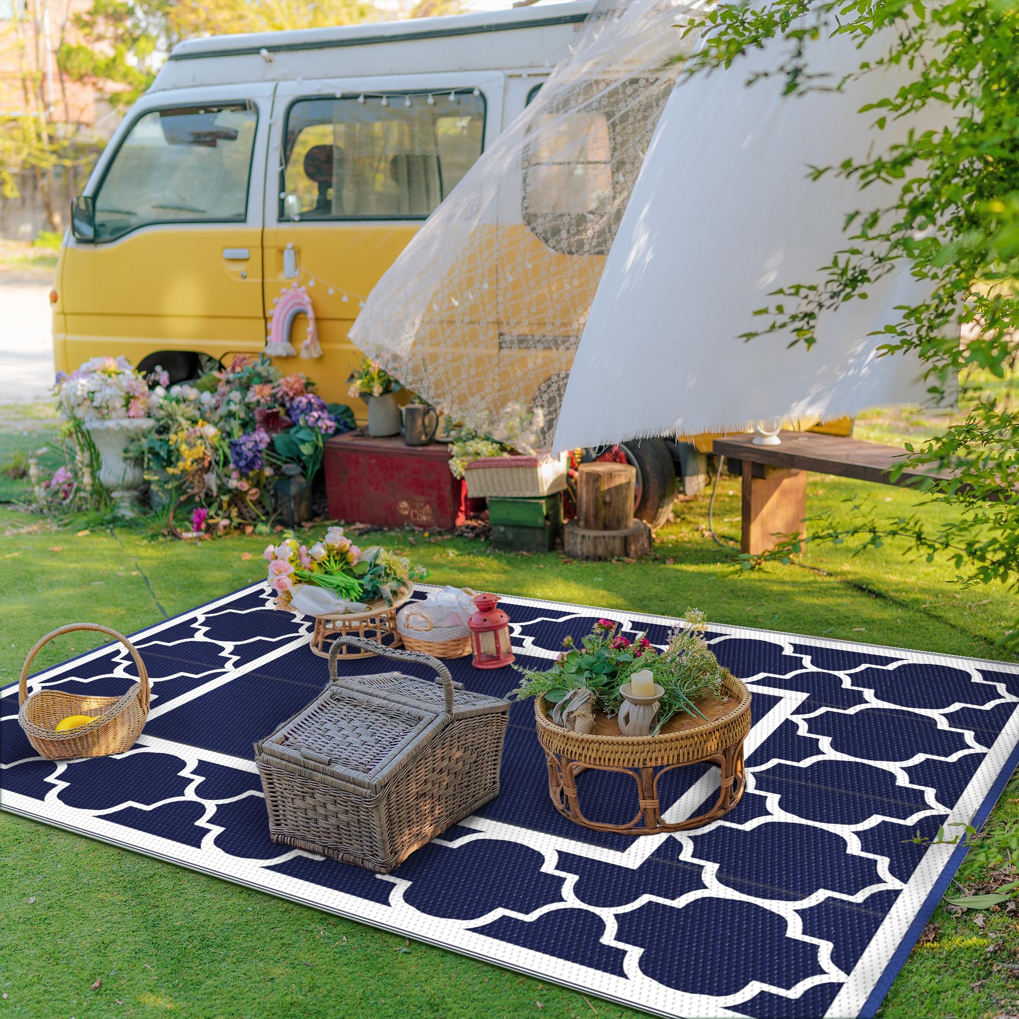 GENIMO blue and white outdoor rug beside RV for cozy outdoor living