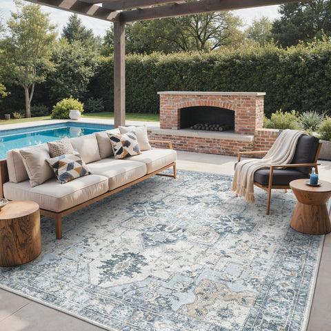 GENIMO 9x12 blue rug in a patio setting, excellent for high-traffic outdoor spaces.