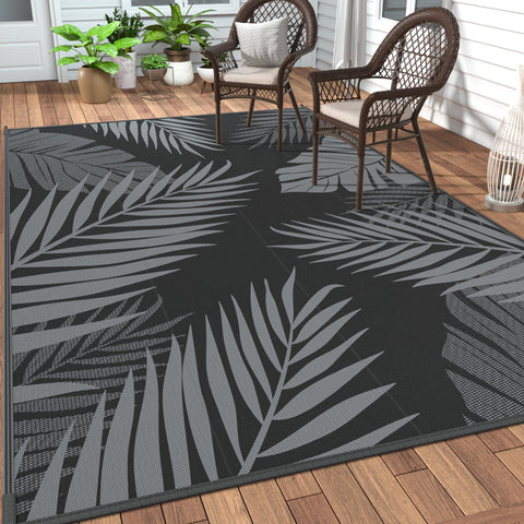 GENIMO outdoor rug palm leaf pattern for patio and beach setups.