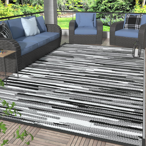 GENIMO 6x9 outdoor rug top view, black and white, soft underfoot for patio comfort