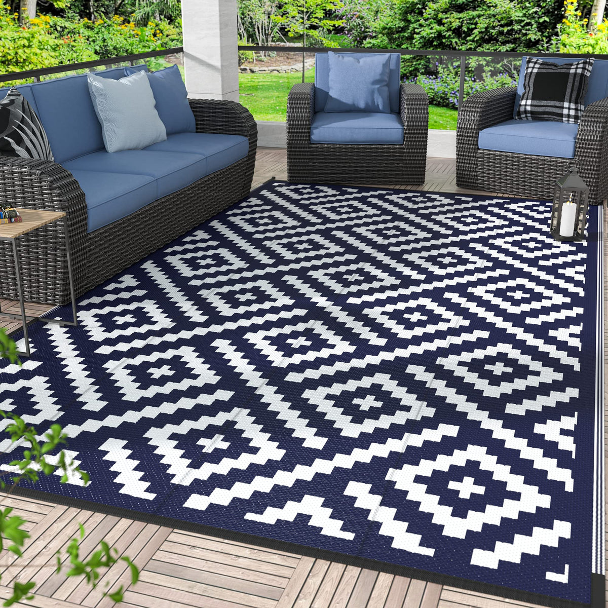 GENIMO 8x10 navy blue and white geometric outdoor rug viewed from above, durable for patios and camps.
