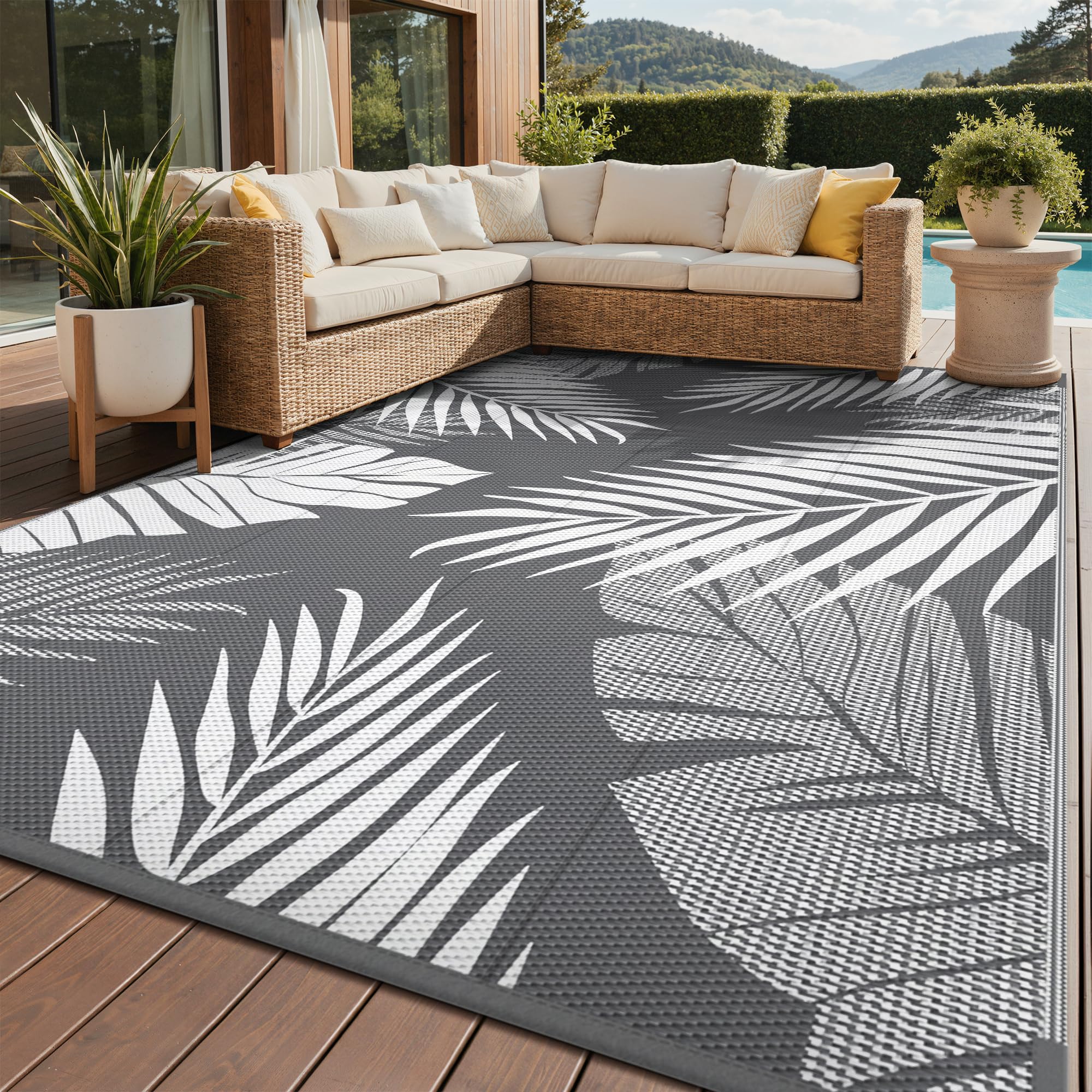 GENIMO outdoor rug palm leaf design, ideal for patios and picnics.