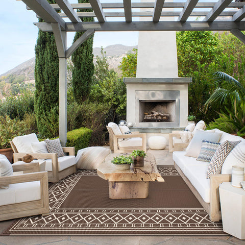 GENIMO geometric center rug highlighting a bold pattern for porch and deck focal point.