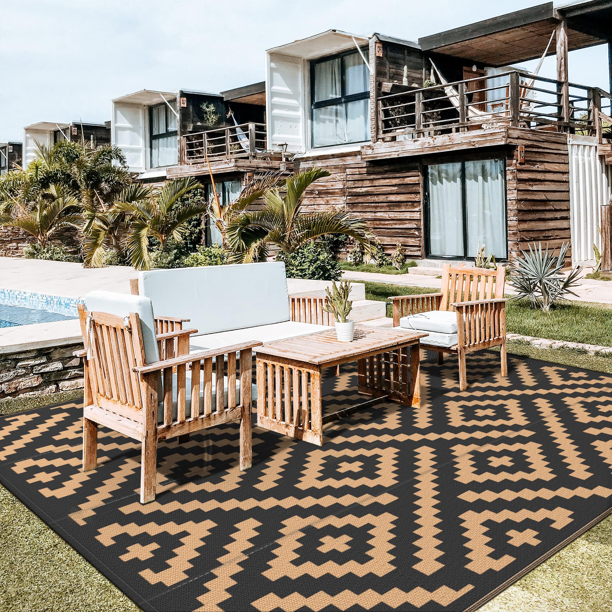 GENIMO outdoor rug with black and brown geometric pattern enhances outdoor spaces.