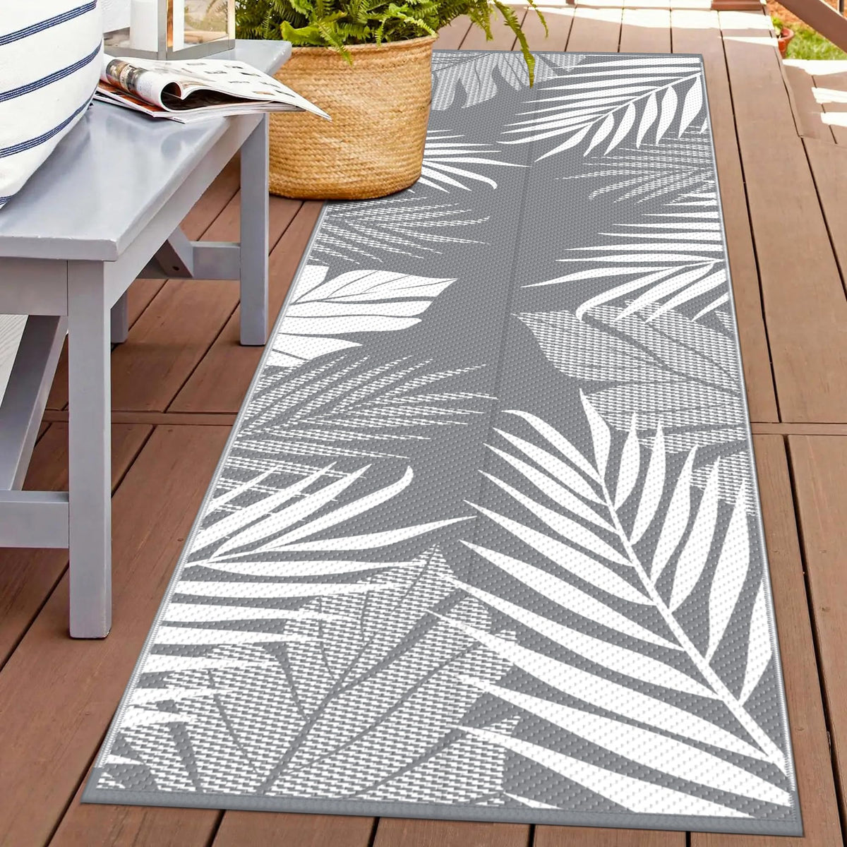 GENIMO outdoor rug with palm leaf front pattern, ideal for patio styling and durable outdoor use.