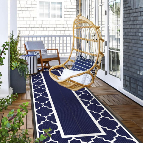 GENIMO reversible plastic straw rug offering two looks for outdoor spaces