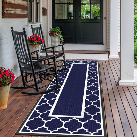 GENIMO waterproof outdoor rug on a deck, drying after a light rain