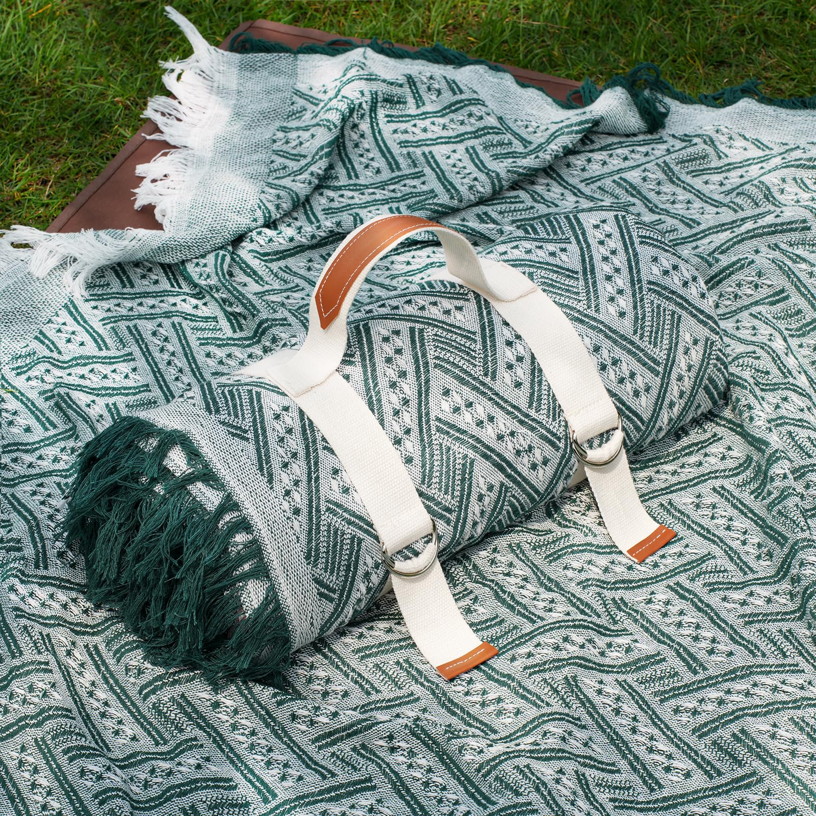 Genovega 80x80 picnic blanket folded for easy carry and quick setup.