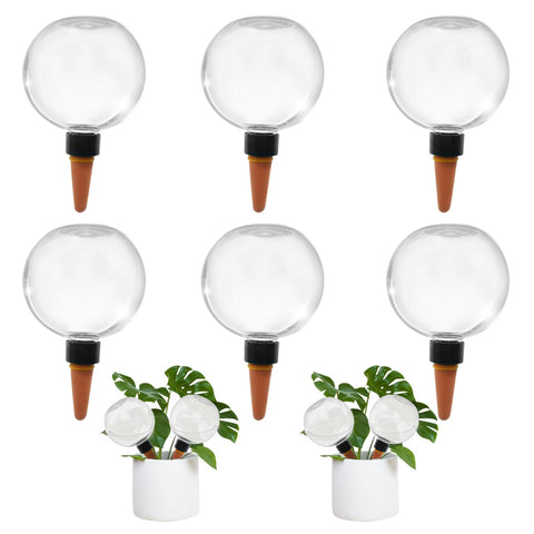 GEWOSI self-watering globes in pots provide ongoing hydration for indoor plants.