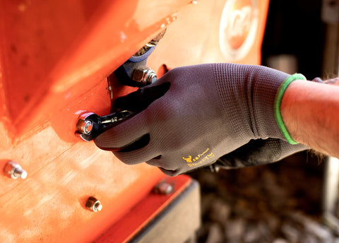 G & F 1520 nitrile-dipped gloves displaying flexible grip on hand.