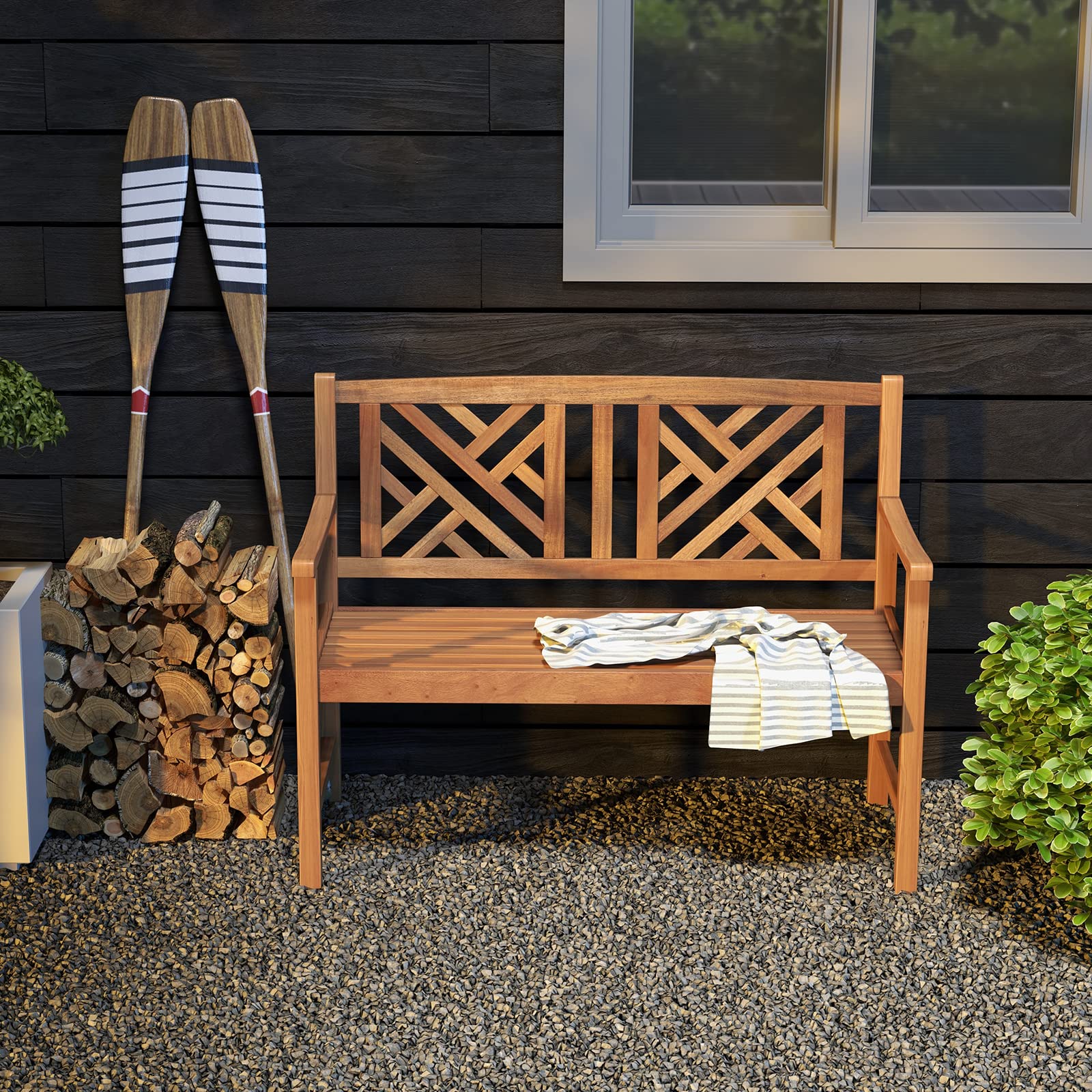 Giantex bench with curved armrests offers comfortable outdoor seating.