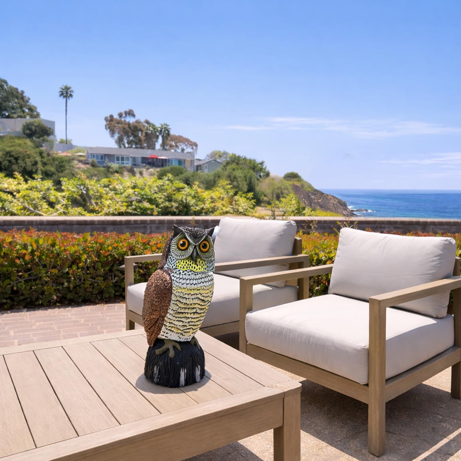 GiftExpress owl decoy in garden setting demonstrates deterrent potential for outdoor spaces.