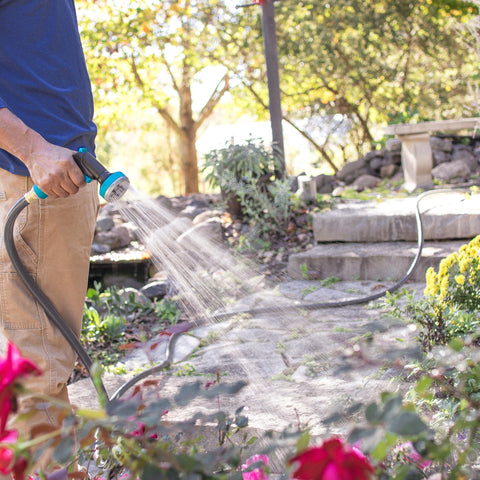 Gilmour Flexogen 100-foot hose ready for yard watering and cleaning tasks.