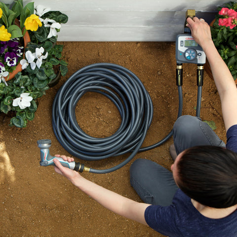 Gilmour Flexogen hose under high pressure demonstrates 500 PSI capacity.